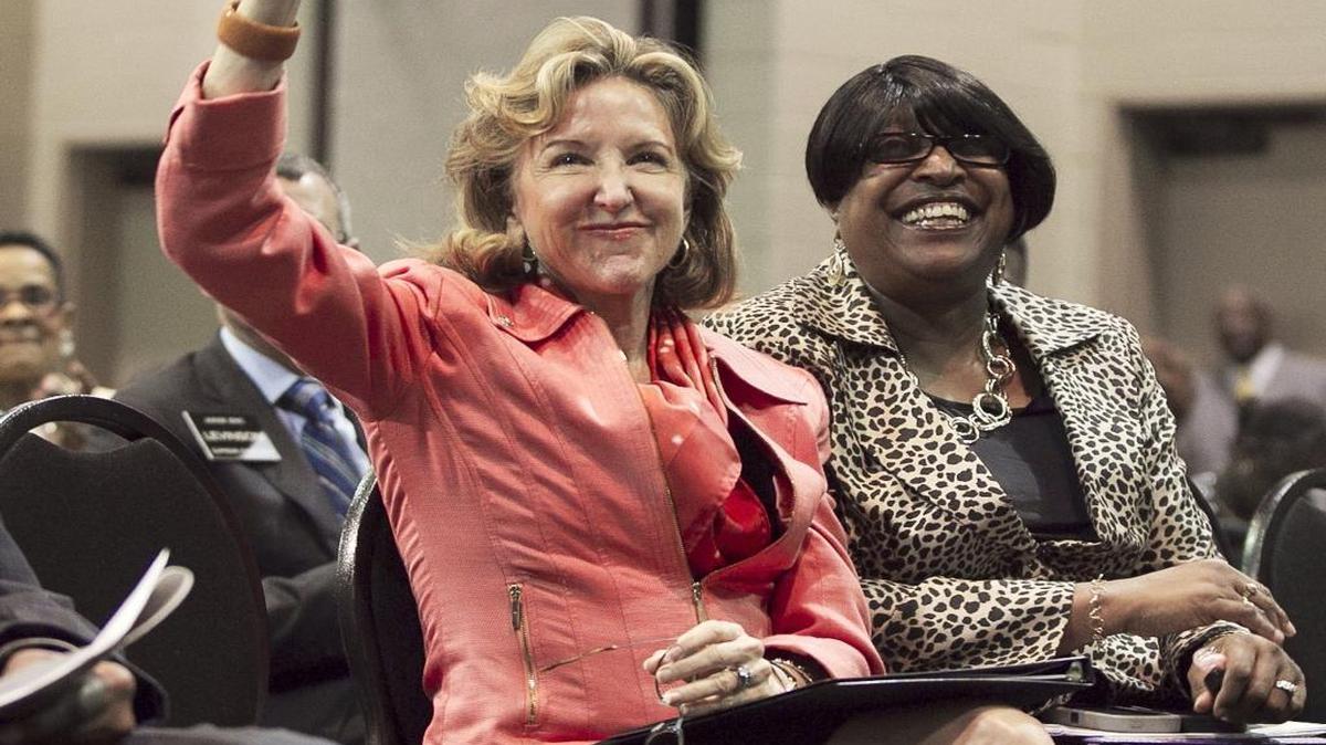 FILE – U.S. Sen. Kay Hagan acknowledges the crowd upon her introduction at the 147th Annual Session of the General Baptist State Convention on October 29, 2014, at the Greenville Convention Center in Greenville, N.C. Hagan was recently diagnosed with encephalitis, a disease likely caused by a virus that leads to inflammation of the brain.