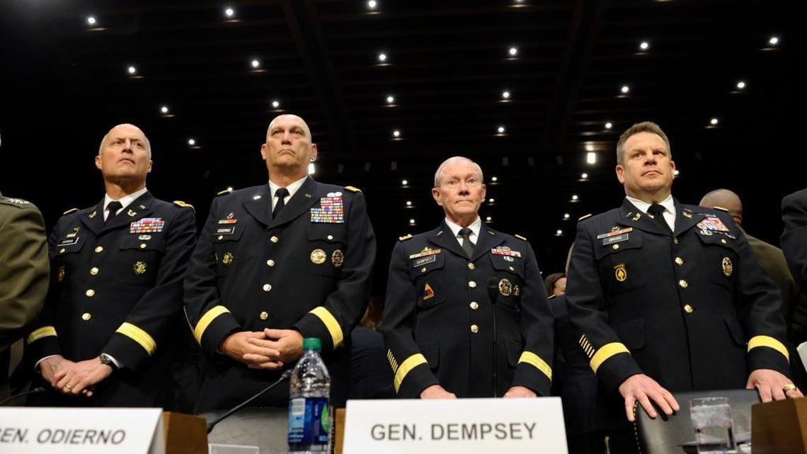 From left, Judge Advocate General of the Army Lt. Gen. Dana Chipman; Army Chief of Staff Gen. Ray Odierno; Joint Chiefs Chairman Gen. Martin Dempsey; and Legal Counsel to the Chairman of the Joint Chiefs of Staff Brig. Gen. Richard Gross, arrive on Capitol Hill in Washington, Tuesday, June 4, 2013, to testify before the Senate Armed Services Committee hearing on pending legislation regarding sexual assaults in the military.