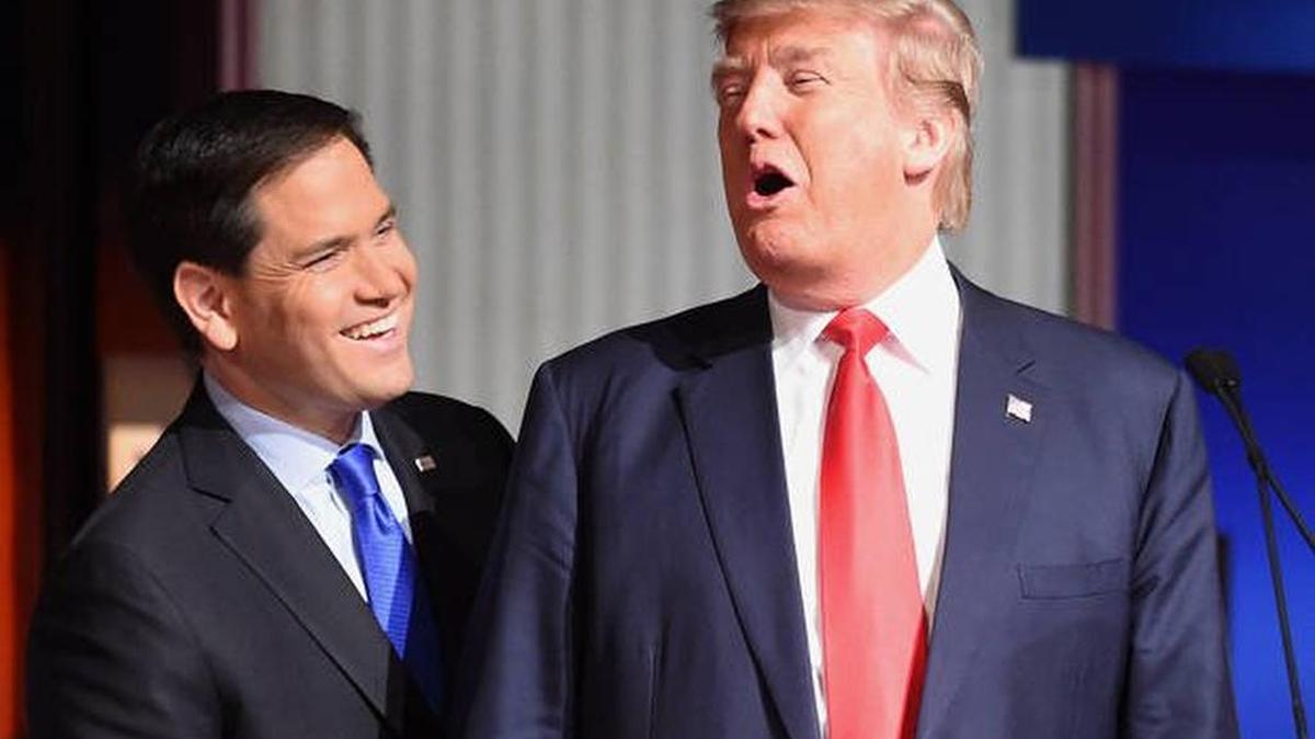 Former Republican presidential primary rivals Marco Rubio and Donald Trump, pictured in a January 2016 debate, worked together to rewrite U.S.-Cuba policy.