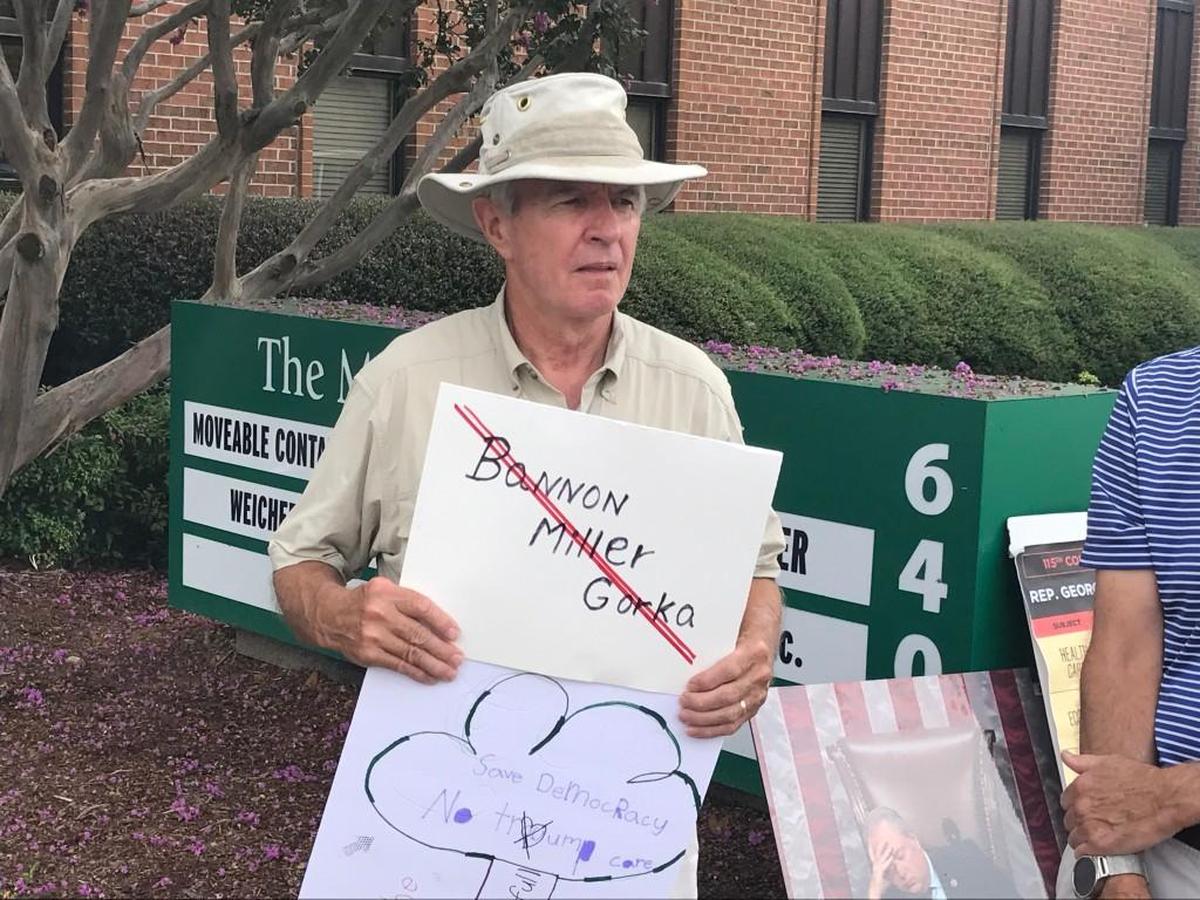 Dewey Botts, 73, attends a rally outside the Raleigh office of Rep. George Holding on Tuesday, August 15, 2017. Botts wants President Trump to fire White House chief strategist Steve Bannon, senior policy advisor Stephen Miller and deputy assistant to the president Sebastian Gorka.