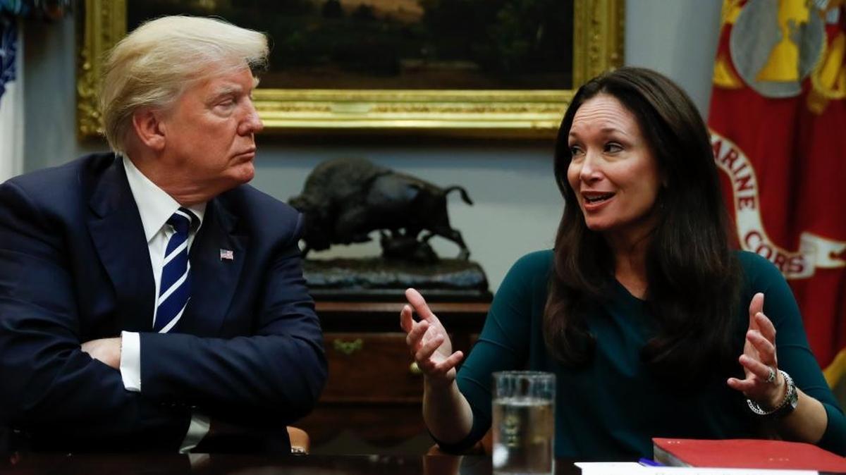President Donald Trump, looks to Brooke Rollins, President and CEO of the Texas Public Policy Foundation, as she speaks during a prison reform roundtable in the Roosevelt Room at the White House.