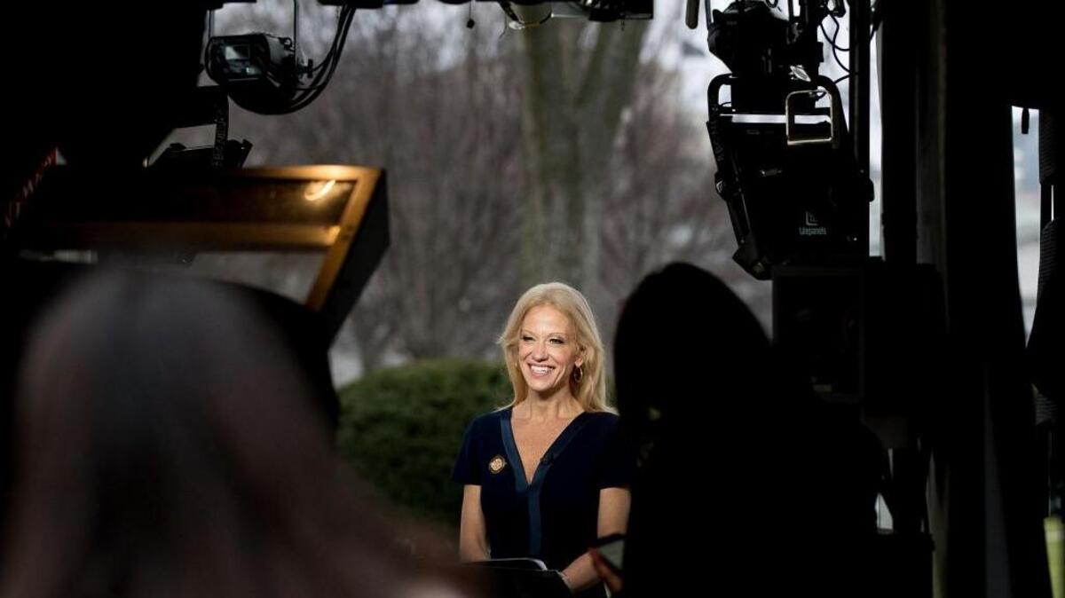 President Donald Trump's adviser Kellyanne Conway gets ready to speak on television outside the White House, Sunday, Jan. 22, 2017, in Washington.