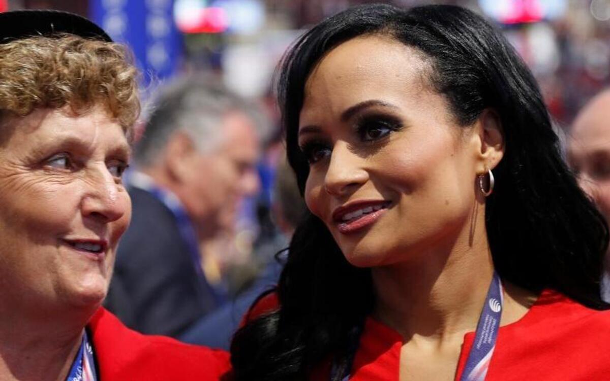 Katrina Pierson, right, talks with delegates on the convention floor during the final day of the Republican National Convention. Pierson recently was spotted at Trump Tower and could be Donald Trump’s press secretary.