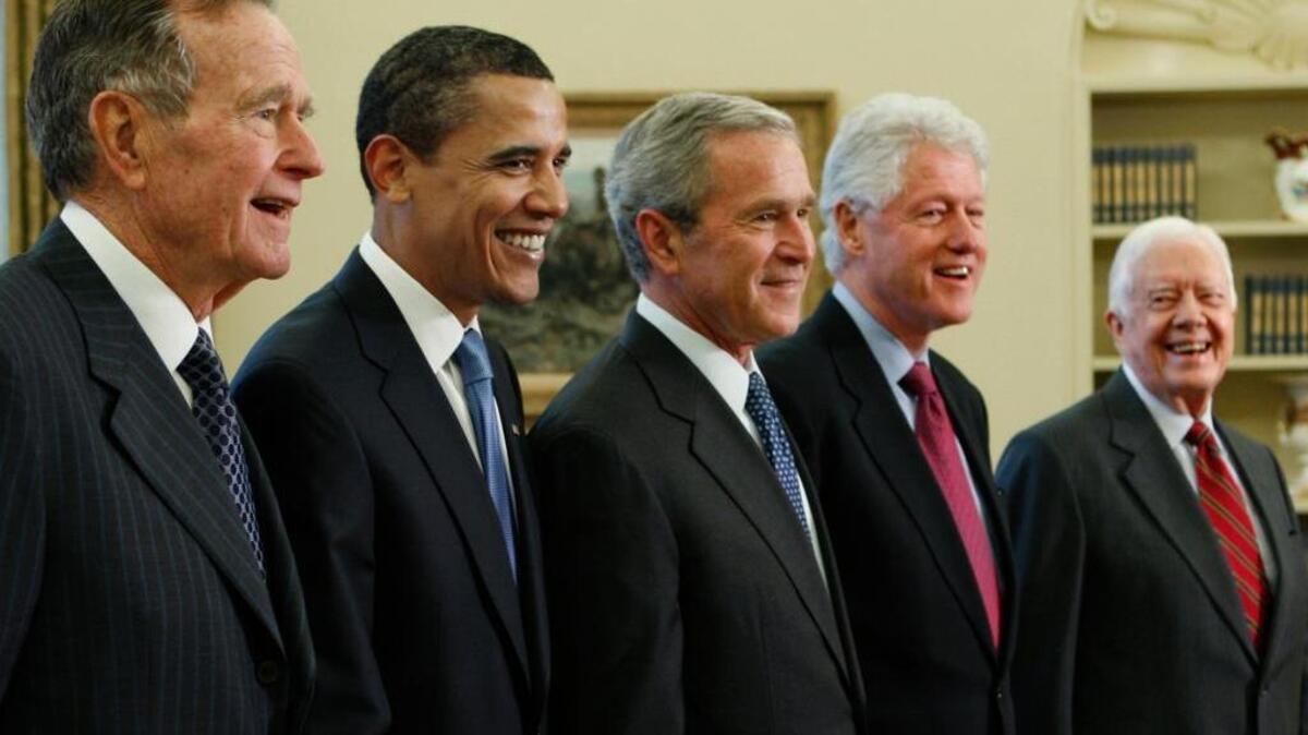 President George W. Bush, center, poses with President-elect Barack Obama, and former presidents, from left, George H.W. Bush, left, Bill Clinton and Jimmy Carter, right, Wednesday, Jan. 7, 2009, in the Oval Office of the White House in Washington.