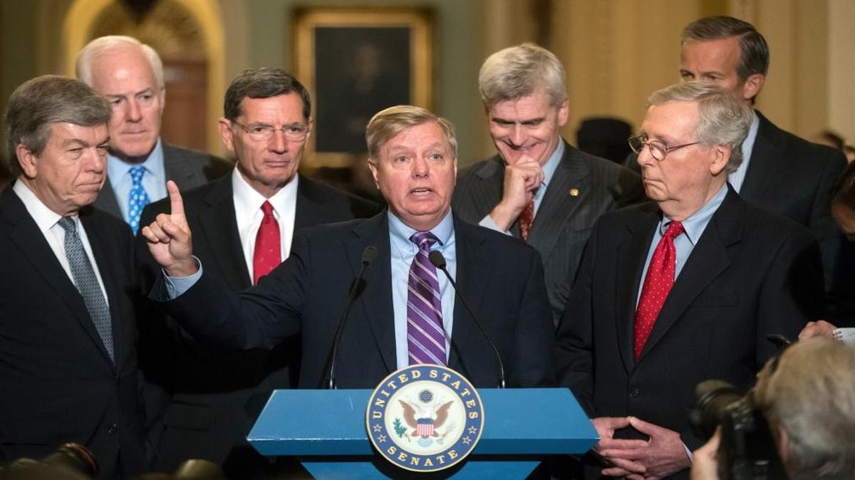 Sen. Lindsey Graham, R-S.C., joined by, from left, Sen. Roy Blunt, R-Mo., Majority Whip John Cornyn, R-Texas, Sen. John Barrasso, R-Wyo., Sen. Bill Cassidy, R-La., Senate Majority Leader Mitch McConnell, R-Ky., and Sen. John Thune, R-S.D., speaks to reporters as he pushes a last-ditch effort to uproot former President Barack Obama's health care law.
