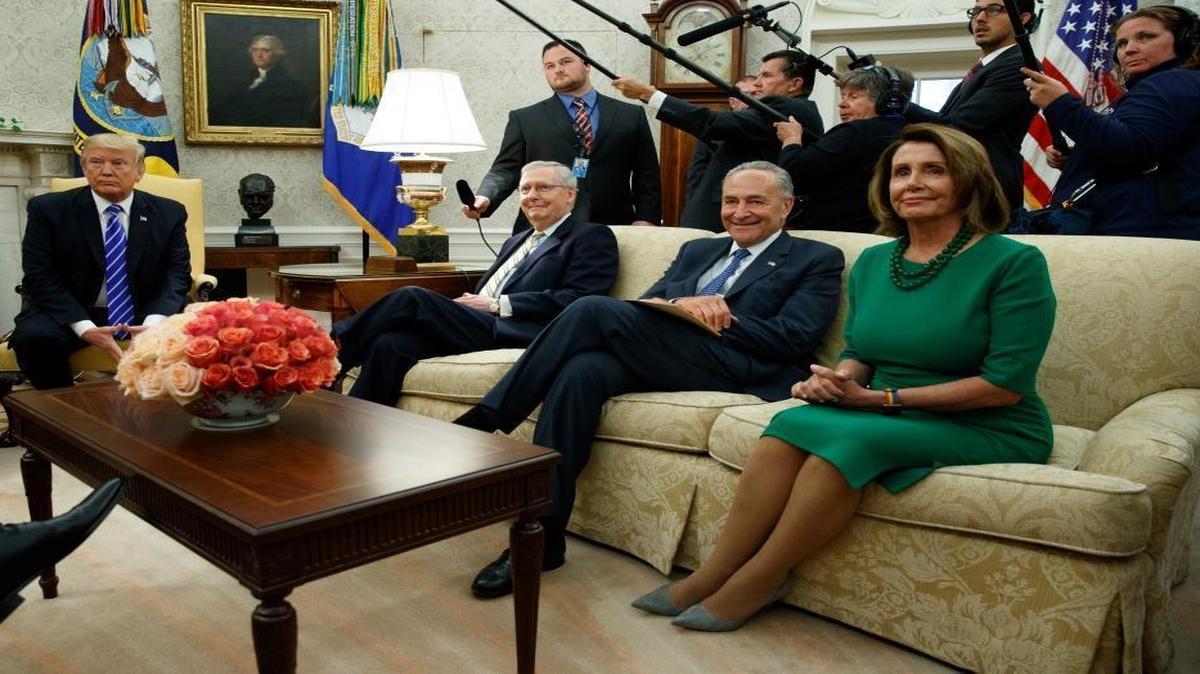 President Donald Trump meets with, from left, Senate Majority Leader Mitch McConnell, R-Ky., Senate Minority Leader Chuck Schumer, D-N.Y., and House Minority Leader Nancy Pelosi, D-Calif., and other Congressional leaders in the Oval Office of the White House, Wednesday, Sept. 6, 2017, in Washington.