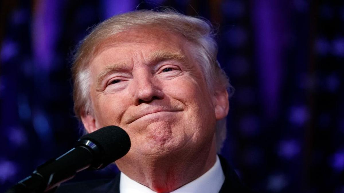 President-elect Donald Trump smiles as he arrives to speak at an election night rally in New York. Trump is reportedly considering Texas billionaire Toby Neugebauer as ambassador to Mexico.