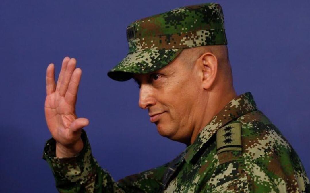 Gen. Jaime Lasprilla Villamizar, a Colombian army chief relieved of duties following a scathing report on the summary killing of almost 3,000 peasants, quietly resurfaced in his nation’s embassy in the U.S., to the ire of rights groups. In photo, Lasprilla waves after being appointed army commander in Bogota, Colombia, Feb. 18, 2014.