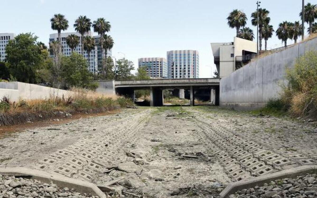
Looking south, one can see the dried up Guadalupe River near Santa Clara Street in San Jose, Calif., on July 17, 2015.

