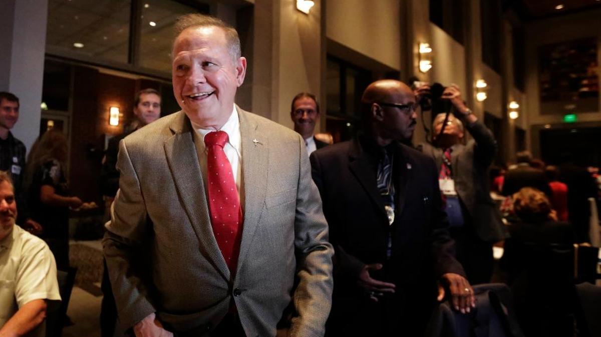 FILE- In this Sept. 26, 2017, file photo, former Alabama Chief Justice and U.S. Senate candidate Roy Moore greets supporters before his election party in Montgomery, Ala. Allegations of Moore’s sexual misconduct are shaking up the Alabama special Senate election.