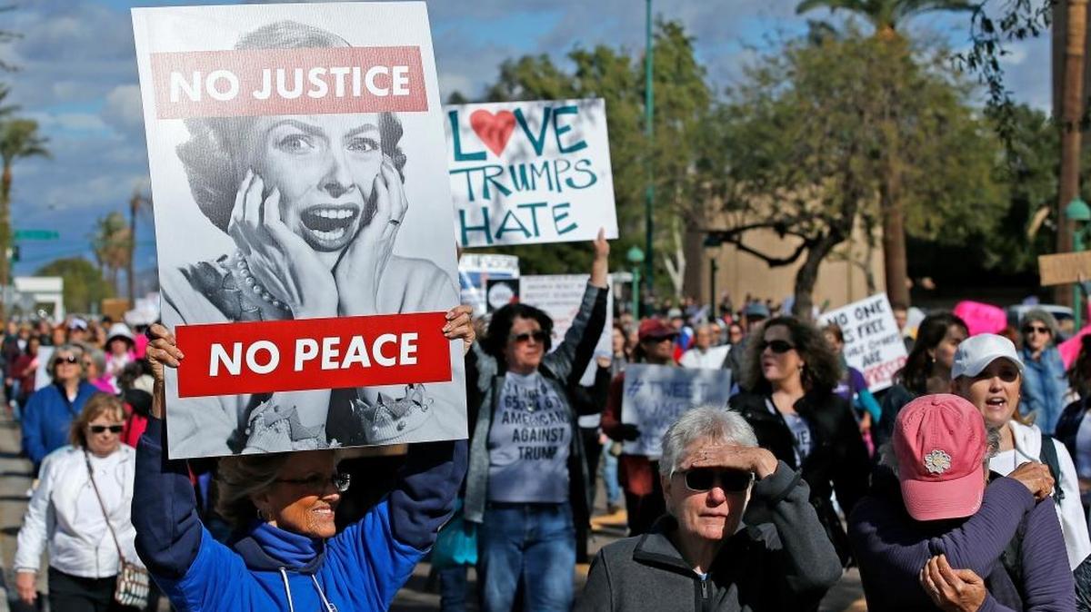 Demonstrators march in support of the Women's March in Washington, Saturday, Jan. 21, 2017, in Phoenix.