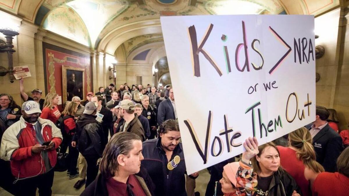 Advocates on both sides of the gun rights issue gather as two gun control measures are introduced at the Capitol, Thursday, March 1, 2018 in St. Paul, Minn. The issue of addressing gun violence is especially potent in moderate suburban districts.