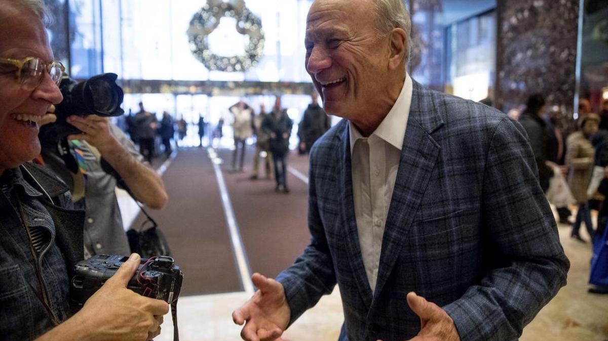 Former football player and coach Barry Switzer speaks to members of the media in the lobby of Trump Tower in New York, Wednesday, Dec. 7, 2016.