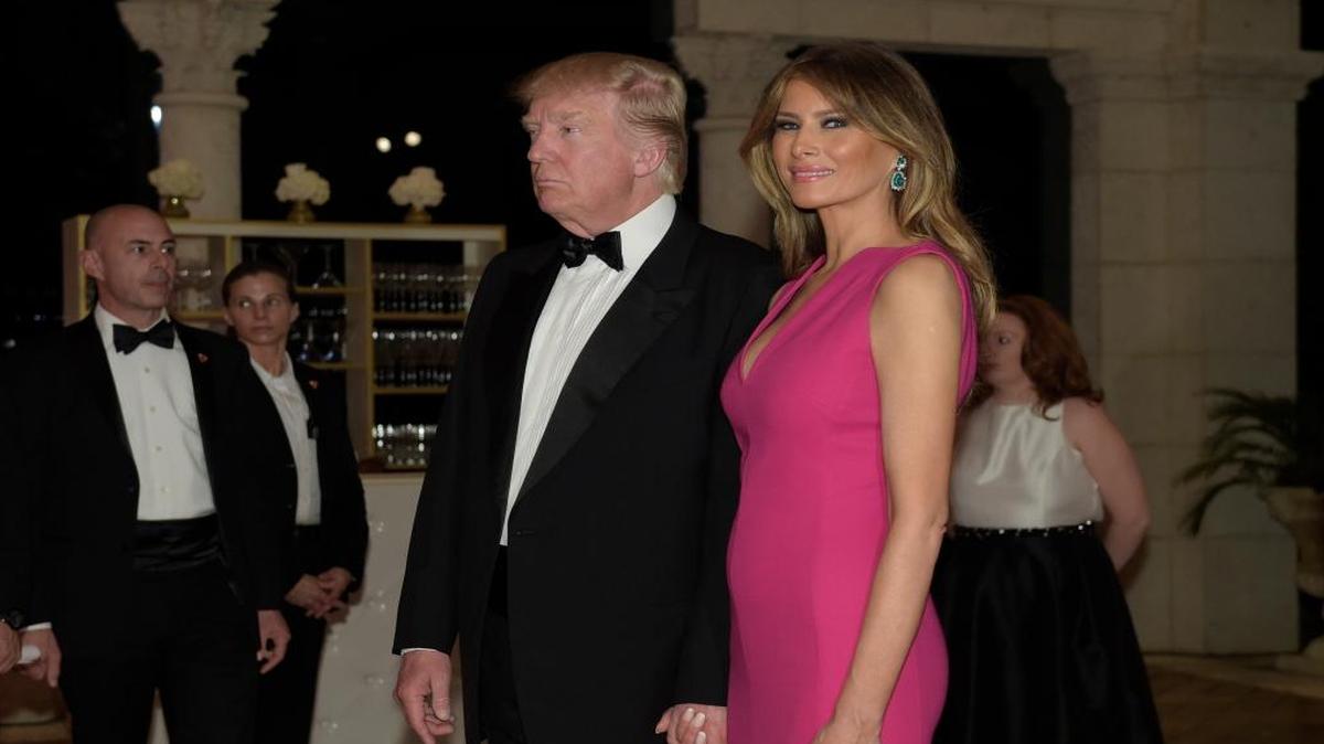 President Donald Trump and first lady Melania Trump arrive for the 60th annual Red Cross Gala at Trump's Mar-a-Lago resort in Palm Beach, Fla., Saturday, Feb. 4, 2017.