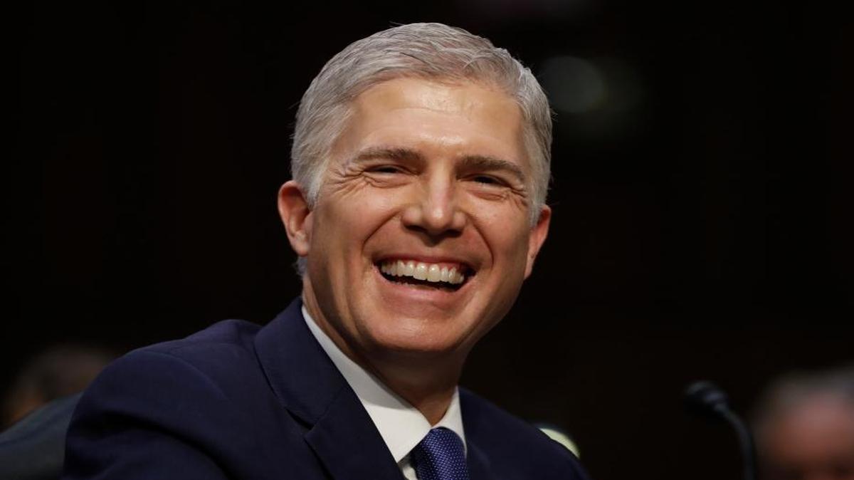 Supreme Court then-nominee Neil Gorsuch smiles on Capitol Hill in Washington, March 20, 2017, during his confirmation hearing before the Senate Judiciary Committee.