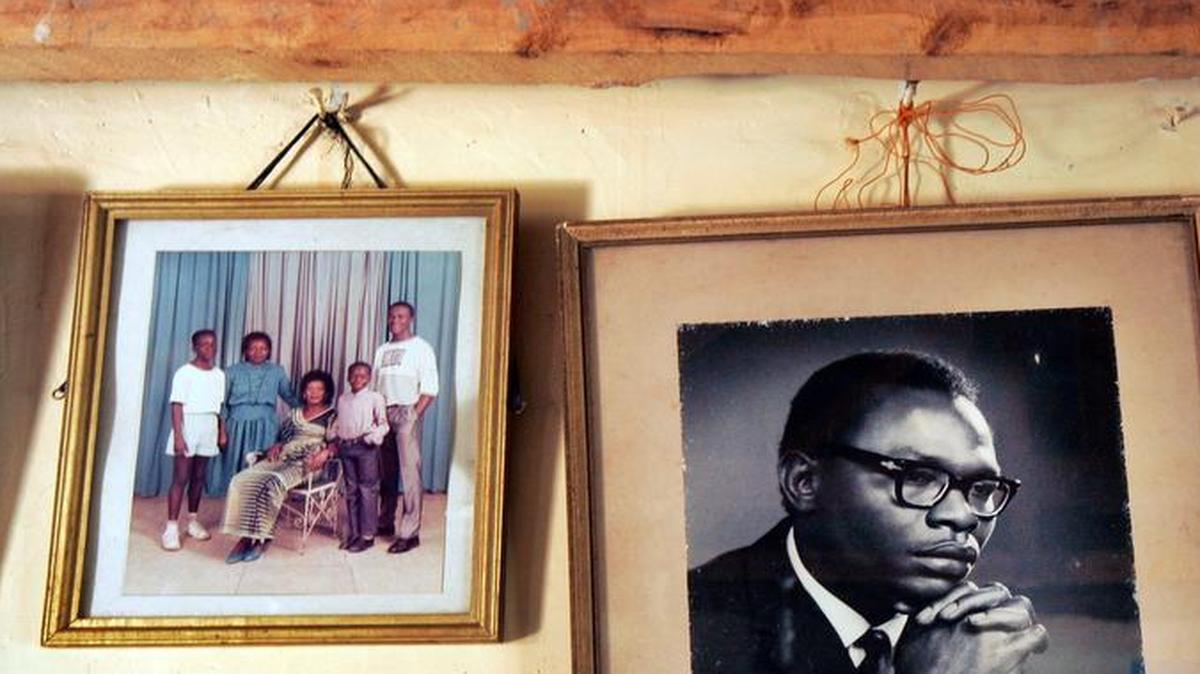 
** FILE ** In this Feb. 5, 2008 file photo, a photograph of Barack Obama Sr., father of Democratic presidential hopeful, Sen. Barack Obama, D-Ill., hangs on the wall of his grandmother Sarah Hussein Obama's house in the village of Kogelo, near the shores of Lake Victoria, Kenya. 
