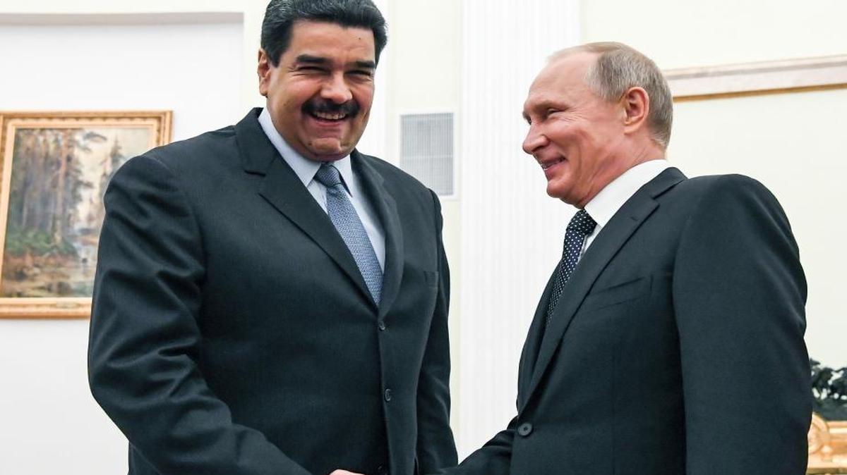 Russian President Vladimir Putin, right, shakes hands with Venezuela's President Nicolas Maduro during their meeting at the Kremlin in Moscow, Russia, Wednesday, Oct. 4, 2017.