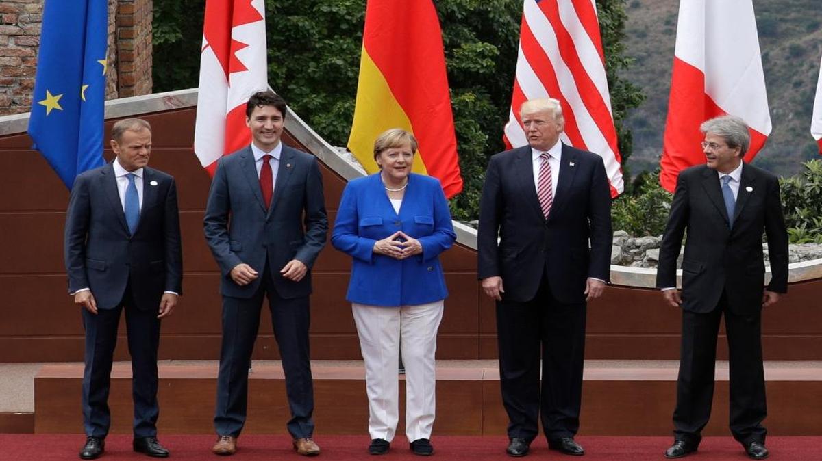 European Council President Donald Tusk, Canadian Prime Minister Justin Trudeau, German Chancellor Angela Merkel, President Donald Trump and Italian Prime Minister Paolo Gentiloni pose during the G-7 summit in Taormina, Italy.