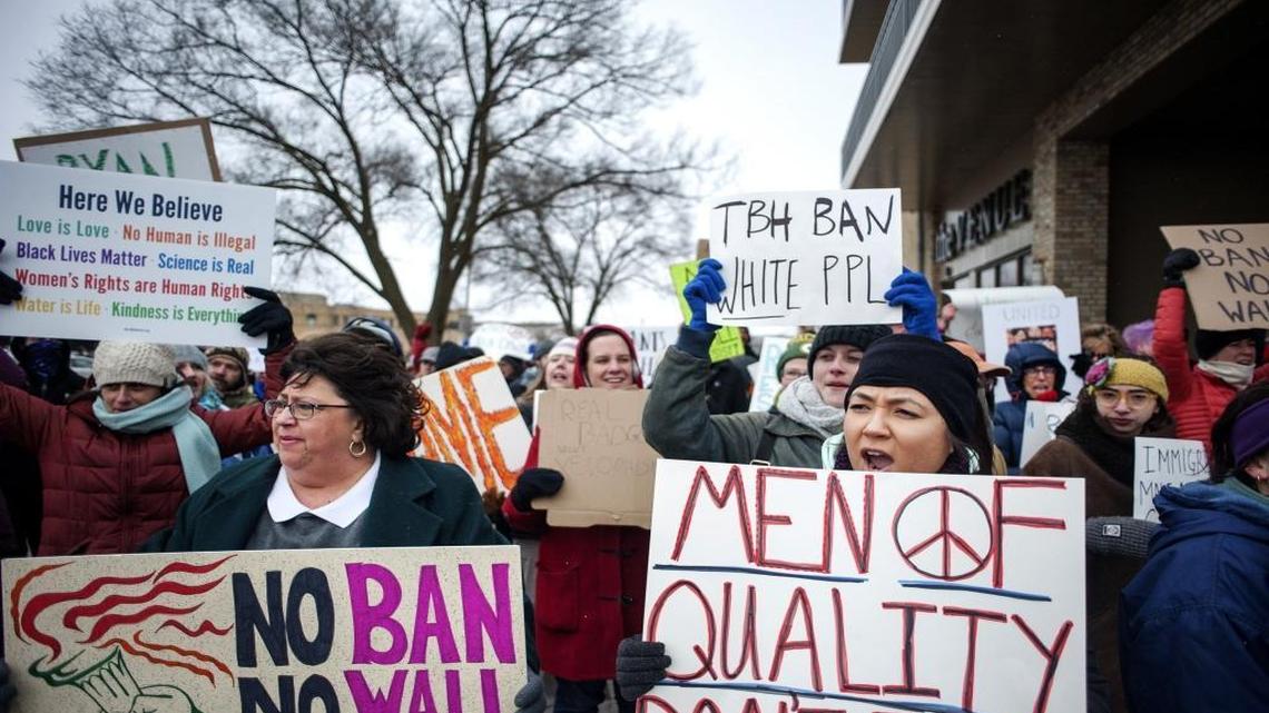Protesters denounce President Donald Trump's immigration orders in Janesville, Wis.