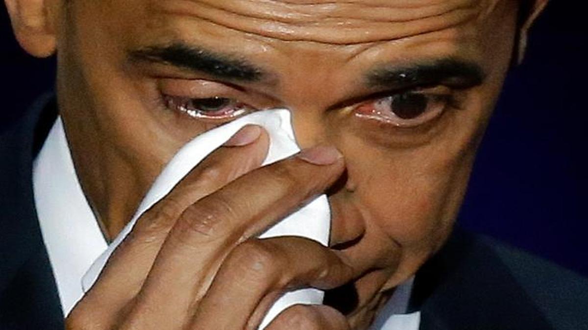 President Barack Obama wipes his tears as he speaks at McCormick Place in Chicago on Tuesday, Jan. 10, 2017.