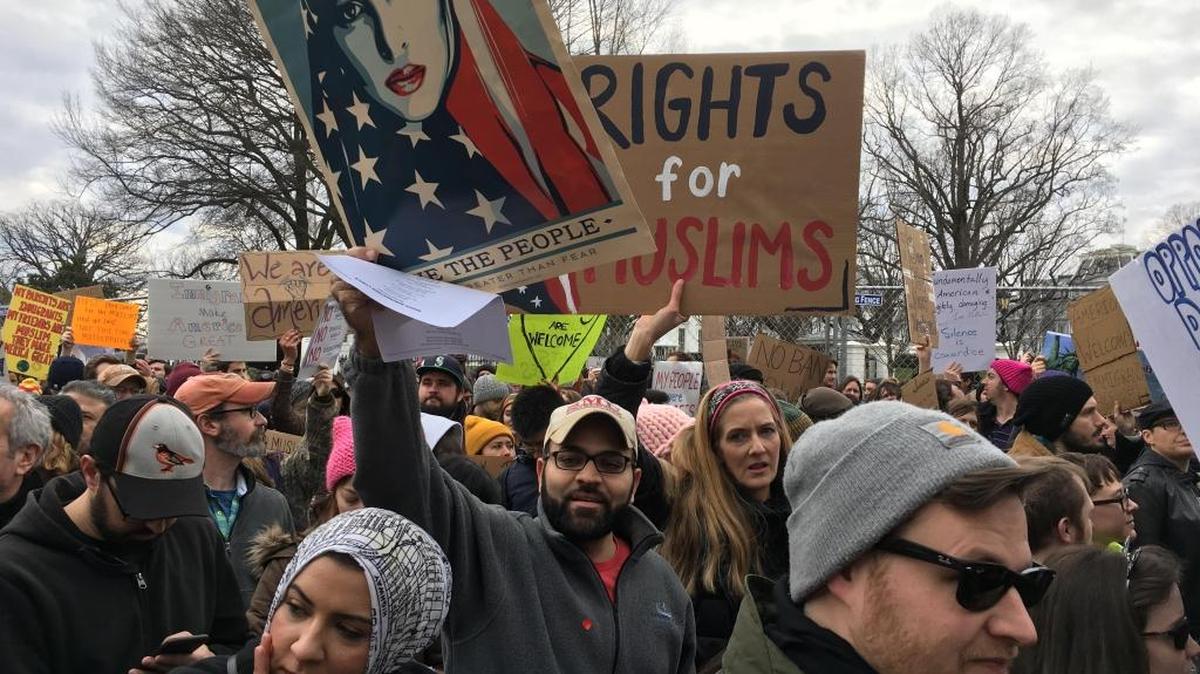 Ahmed El-Ashram, a 32-year-old Egyptian-American, holds a sign while joining a demonstration outside the White House Sunday against President Donald Trump’s executive order limiting Muslim travel to the United States, on Jan. 29, 2017 in Washington DC.