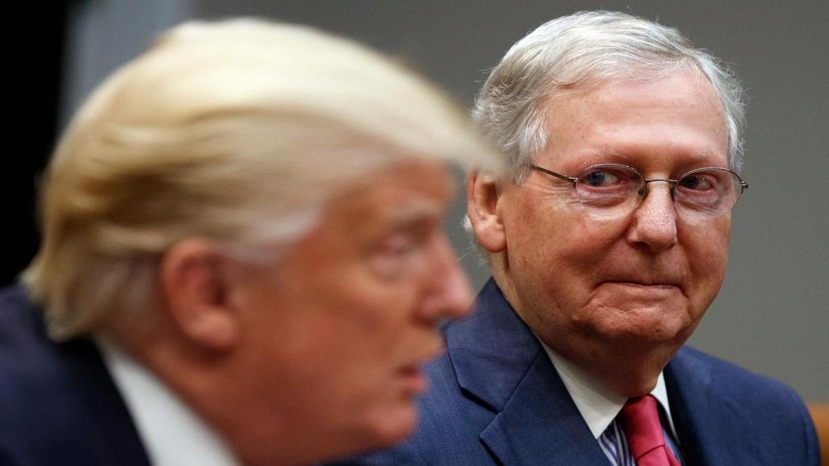 Senate Majority Leader Mitch McConnell, R-Ky., right, listens as President Donald Trump speaks during a meeting with Congressional leaders and administration officials on tax reform, in the Roosevelt Room of the White House, Tuesday, Sept. 5, 2017, in Washington.