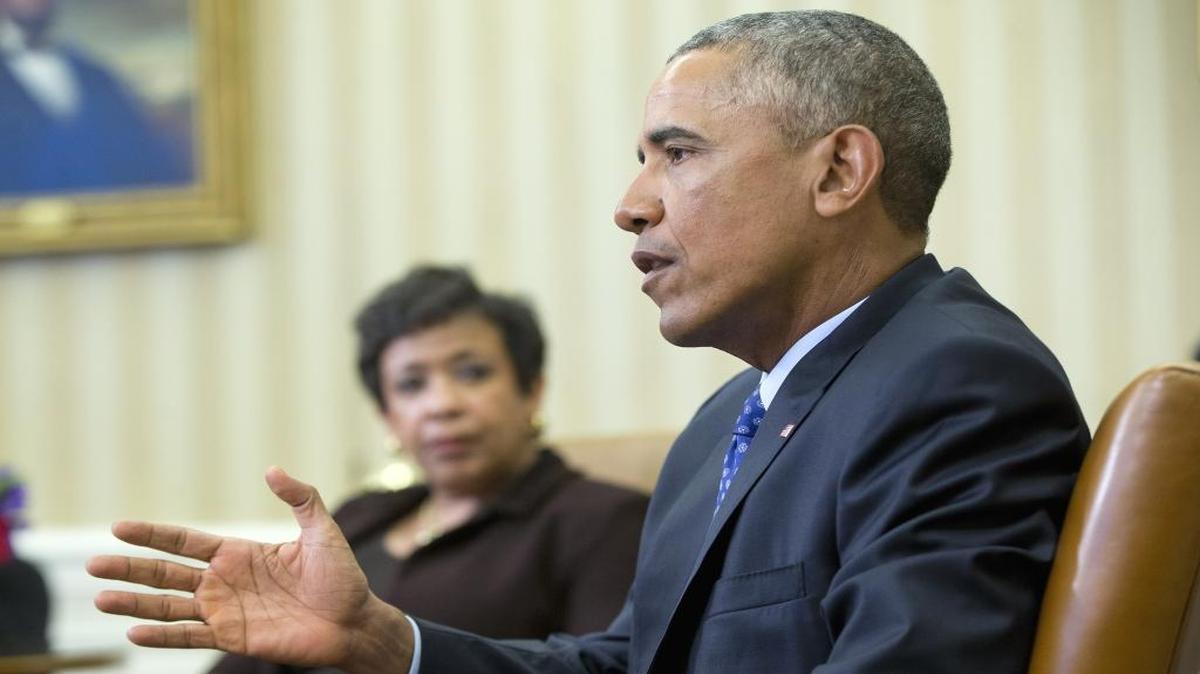 Attorney General Loretta Lynch listens as President Barack Obama speaks in the Oval Office of the White House in Washington on Monday, Jan. 4, 2016, during a meeting with law enforcement officials to discuss executive actions the president can take to curb gun violence. The president is slated to finalize a set of new executive actions tightening U.S. gun laws, kicking off his last year in office with a clear signal that he intends to prioritize one of the country's most intractable issues.