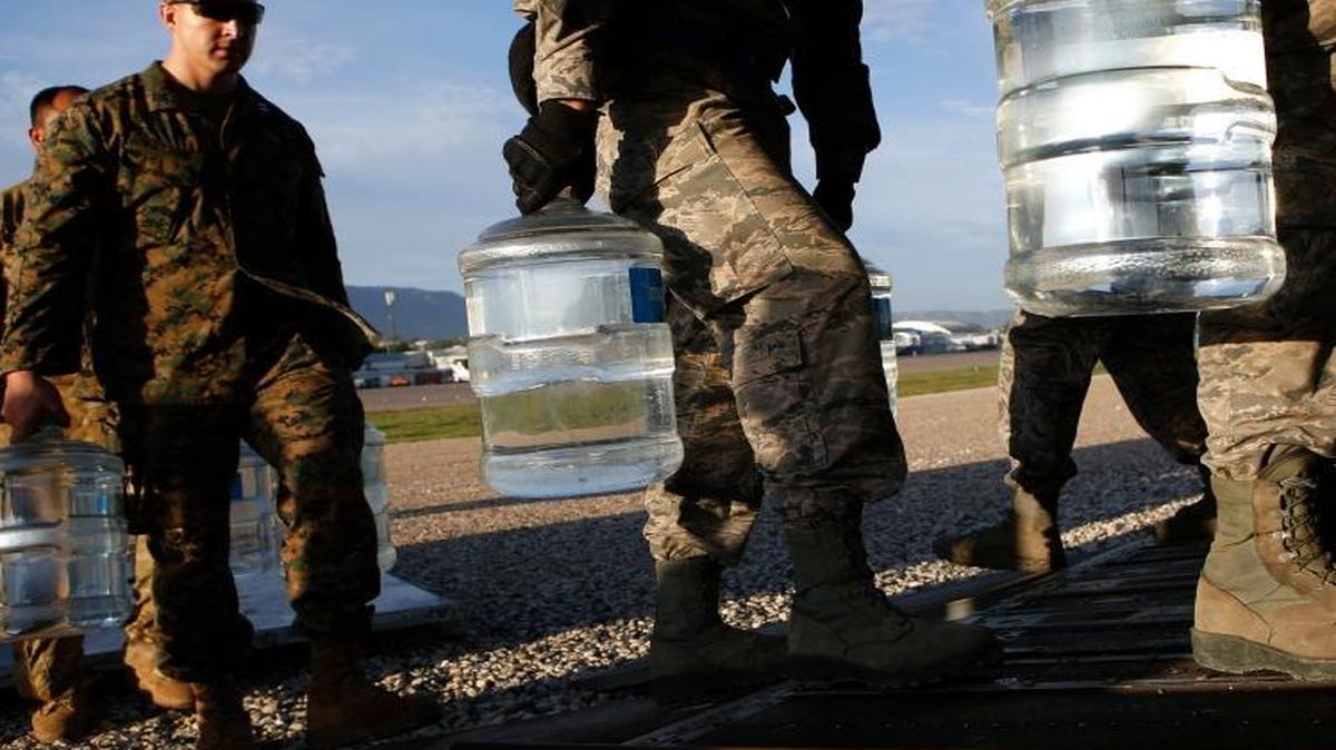 U.S. military troops load jugs of drinking water into a helicopter at the airport in Port-au-Prince, Haiti, in October 2016. Such assistance might be cut under Trump plans to reduce the budget of the U.S. Agency for International Development.