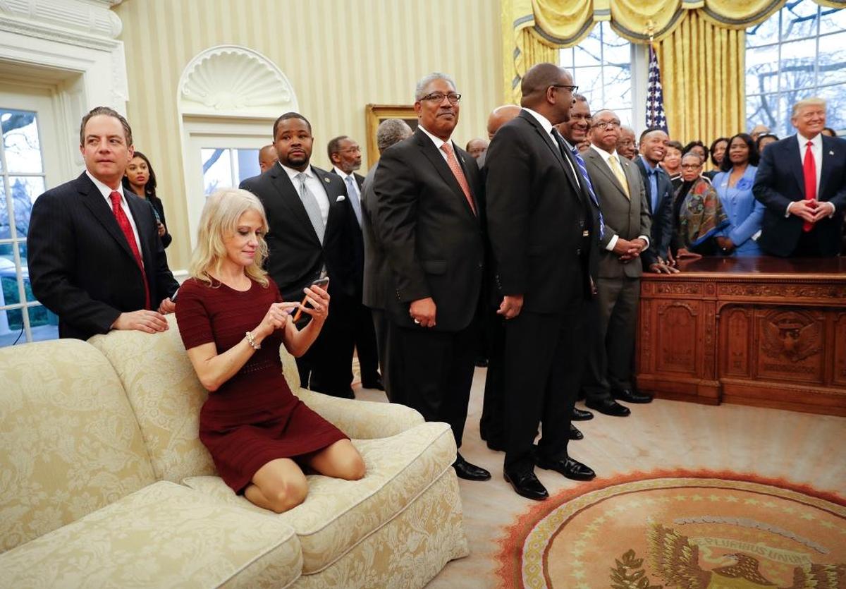 President Donald Trump, right, meets with leaders of historically black colleges and universities in the Oval Office of the White House in Washington, Monday, Feb. 27, 2017. Also at the meeting are White House Chief of Staff Reince Priebus, left, and Counselor to the President Kellyanne Conway, on the couch.