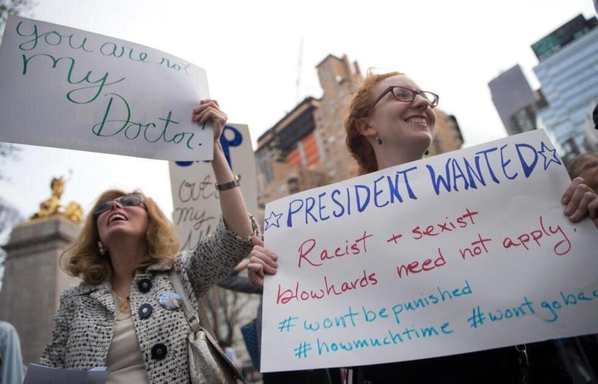 Emily Kadar, right, and Debra Cooper participate in a rally to condemn President-elect Donald Trump’s remarks about women and abortion on March 31, 2016, in New York.