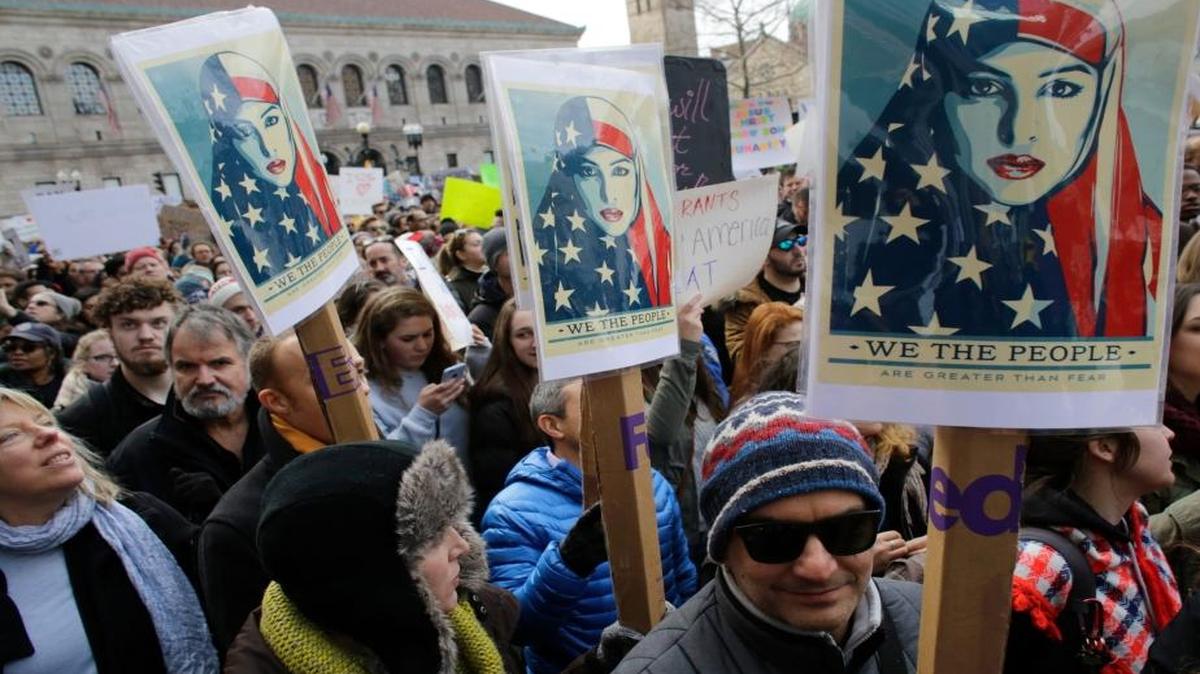 Demonstrators displayed placards during a rally against President Donald Trump’s initial travel-ban executive order. The order touched off days of demonstrations across the United States.