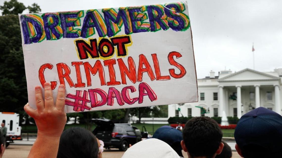 A woman holds up a sign in support of the Obama administration program known as Deferred Action for Childhood Arrivals, or DACA, during an immigration reform rally this month. The Trump administration could announce it is ending the program as early as Friday.