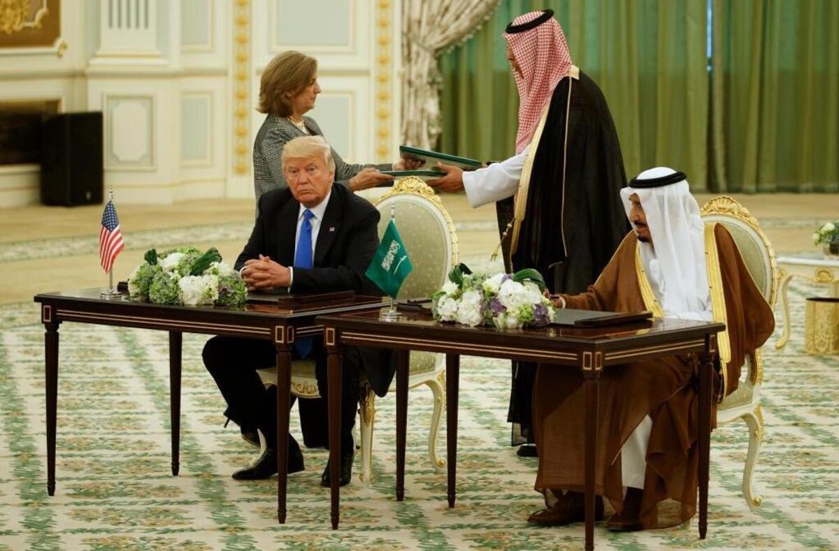 President Donald Trump and Saudi King Salam signed agreements at the Royal Court Palace on Saturday.