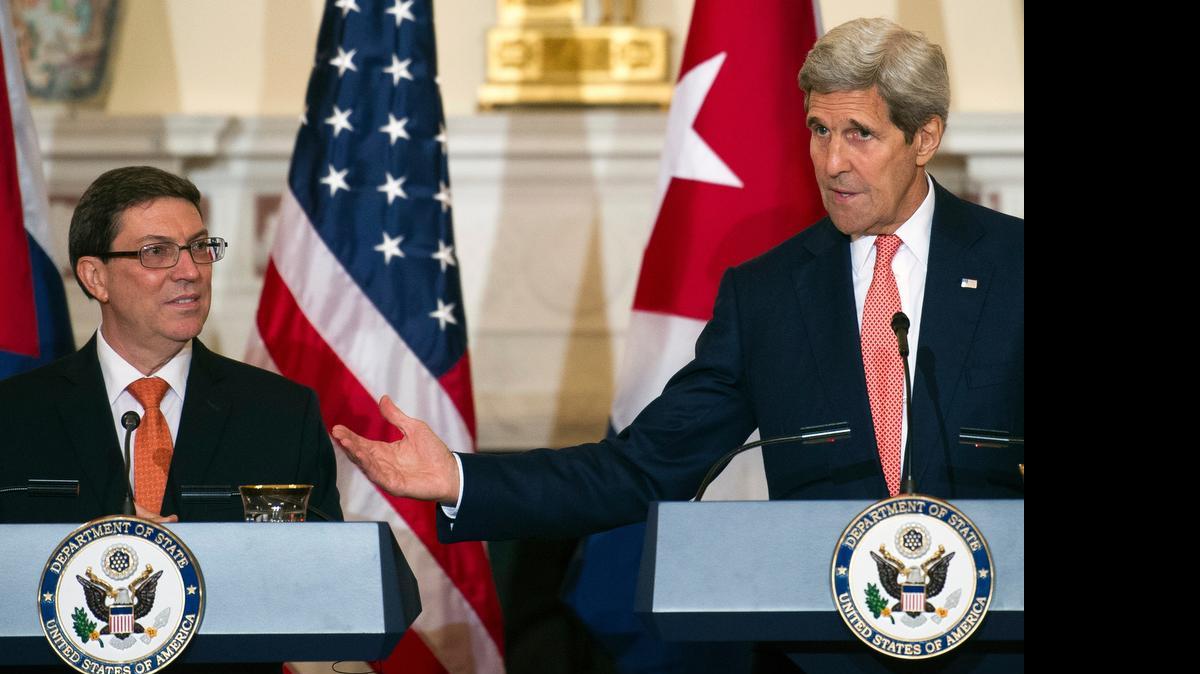 
Secretary of State John Kerry gestures as he and Cuban Foreign Minister Bruno Rodriguez hold a news conference after meeting at the State Department, in Washington, Monday, July 20, 2015. Earlier in the day Rodriguez lead the reopening ceremony of Cuba's U.S. embassy. 
