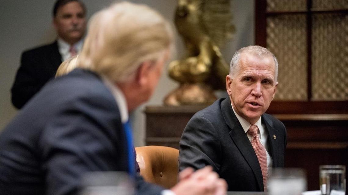 President Donald Trump, left, listens as Sen. Thom Tillis, R-N.C., right, speaks during a meeting with Republican senators on immigration in the Roosevelt Room in the White House, Thursday, Jan. 4, 2018, in Washington.