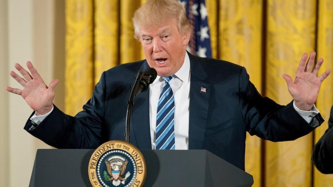 In this Sunday, Jan. 22, 2017, file photo, President Donald Trump speaks during a White House senior staff swearing-in ceremony.