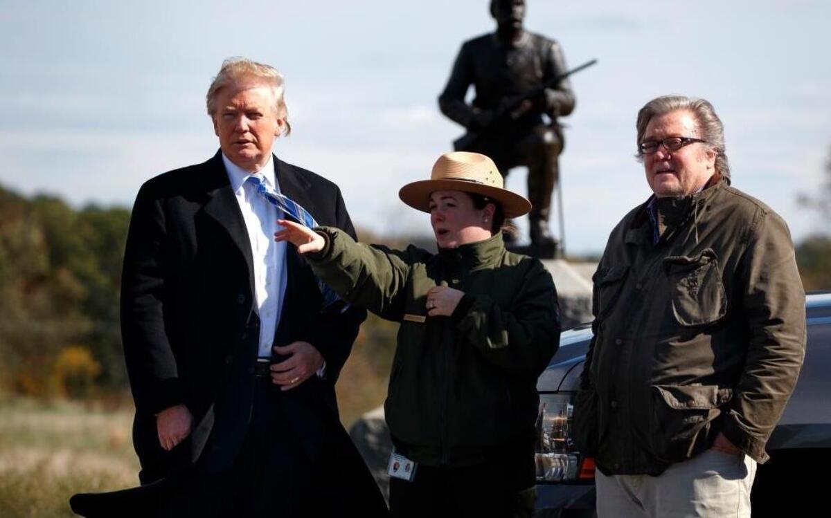 Interpretive park ranger Caitlin Kostic, center, gives a tour of the Gettysburg National Military Park to Republican presidential candidate Donald Trump, left, and Steve Bannon on Oct. 22, 2016, in Gettysburg, Pa. Bannon is a founder and former executive of Breitbart, is one of Trump’s top advisers and has long campaigned to discredit climate change scientists.