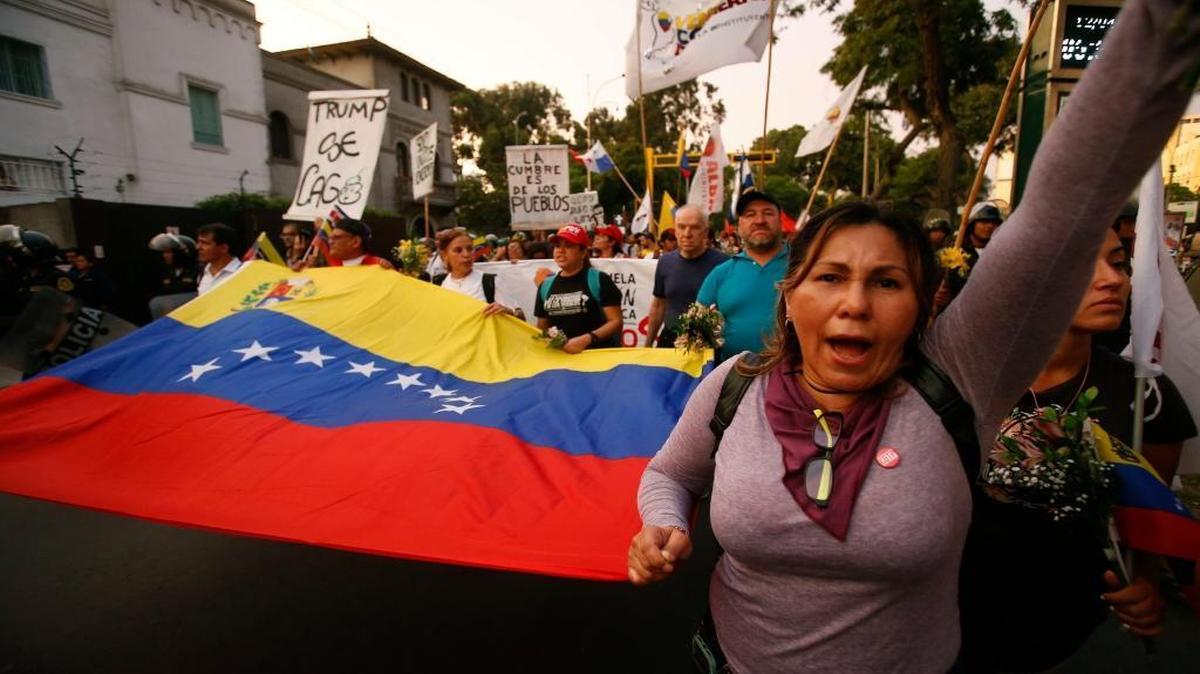 Venezuelans shout anti-Trump slogans during a protest against the Summit of the Americas, in Lima, Peru, Thursday, April 12, 2018. U.S. President Donald Trump had planned to attend the 8th Summit of the Americas in Lima canceled his plans, choosing to stay in Washington to manage the U.S. response to an apparent chemical weapons attack on civilians in Syria.