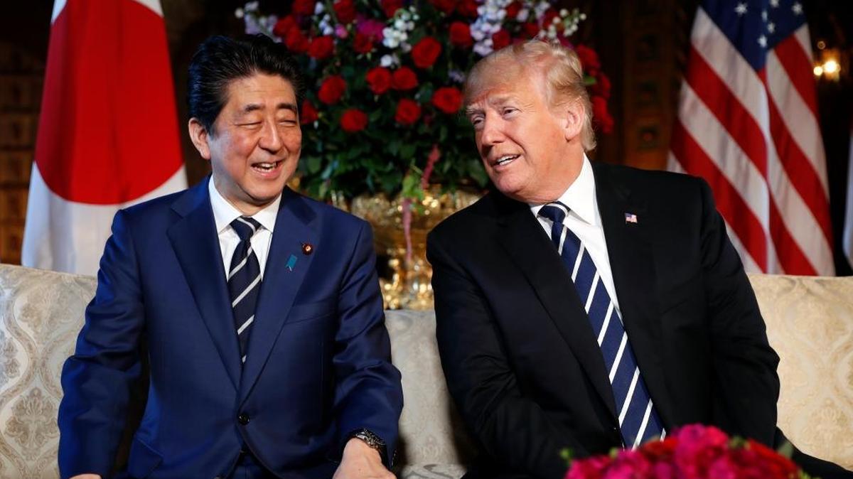 President Donald Trump and Japanese Prime Minister Shinzo Abe smile during their meeting at Trump's private Mar-a-Lago club, Tuesday, April 17, 2018, in Palm Beach, Fla. (AP Photo/Pablo Martinez Monsivais)