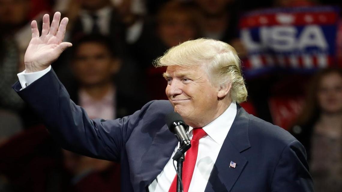 President-elect Donald Trump waves and smiles as he speaks during the first stop of his post-election tour, Thursday, Dec. 1, 2016, in Cincinnati.