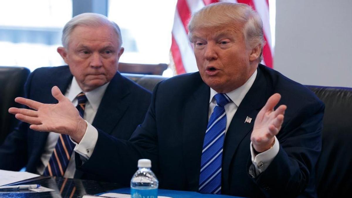 Supporters of marijuana legalization fear that Sen. Sen. Jeff Sessions, R-Ala., at left, will lead a crackdown against their movement if he’s confirmed as the next U.S. attorney general. In this photo, taken Oct. 7, 2016, Sessions listened as President-elect Donald Trump spoke during a national security meeting with advisers at Trump Tower in New York.