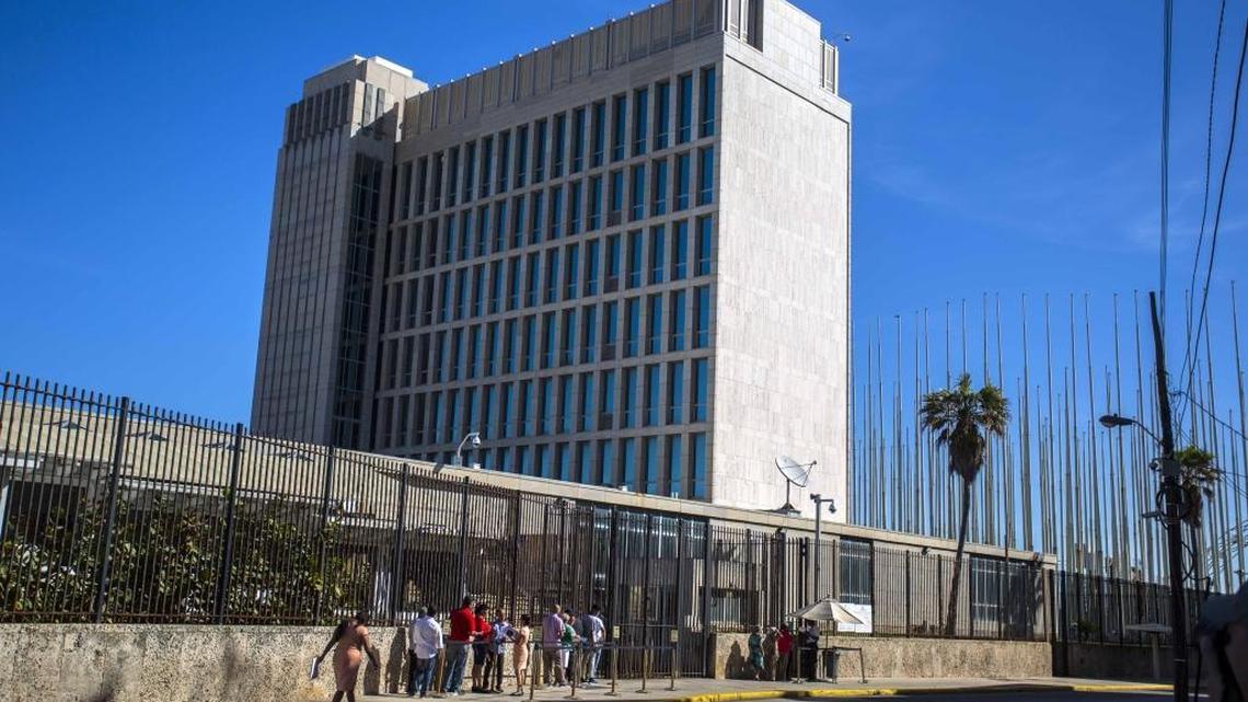 People line up outside the United States embassy in Havana, Cuba, on Wednesday, Nov. 9, 2016. The State Department has expelled two diplomats from Cuba’s Embassy in Washington following a series of unexplained incidents in Cuba that left U.S. officials there with physical symptoms.
