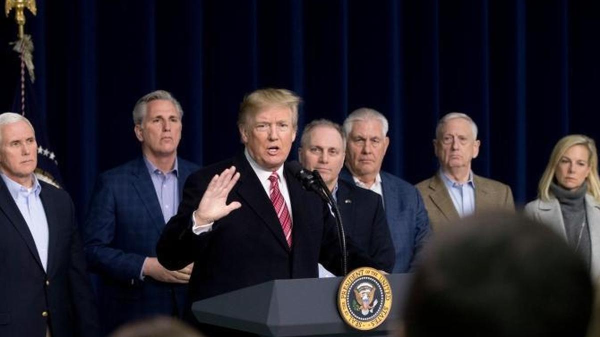 President Donald Trump, fifth from right, accompanied by from left, House Speaker Paul Ryan of Wis., Senate Majority Leader Mitch McConnell of Ky., Vice President Mike Pence, House Majority Leader Kevin McCarthy of Calif., House Majority Whip Steve Scalise, R-La., Secretary of State Rex Tillerson, Defense Secretary Jim Mattis, and Secretary of Homeland Security Kirstjen Nielsen, speaks during a news conference after after participating in a Congressional Republican Leadership Retreat at Camp David, Md., Saturday, Jan. 6, 2018.