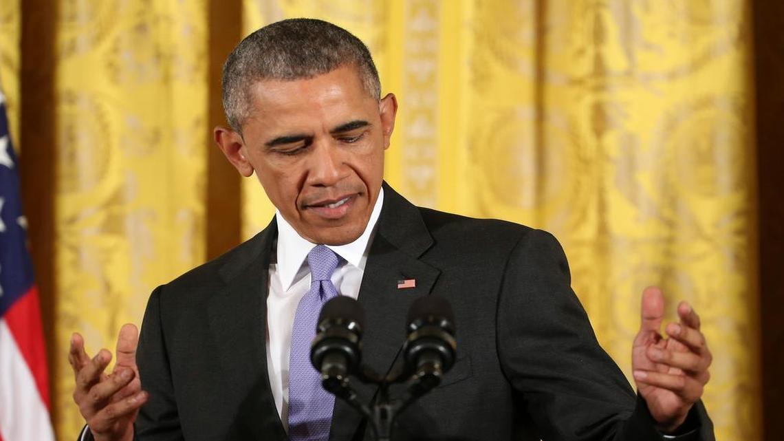 
President Barack Obama steps to the podium before making an opening statement during a news conference in the East Room of the White House in Washington, Wednesday, July 15, 2015. 
