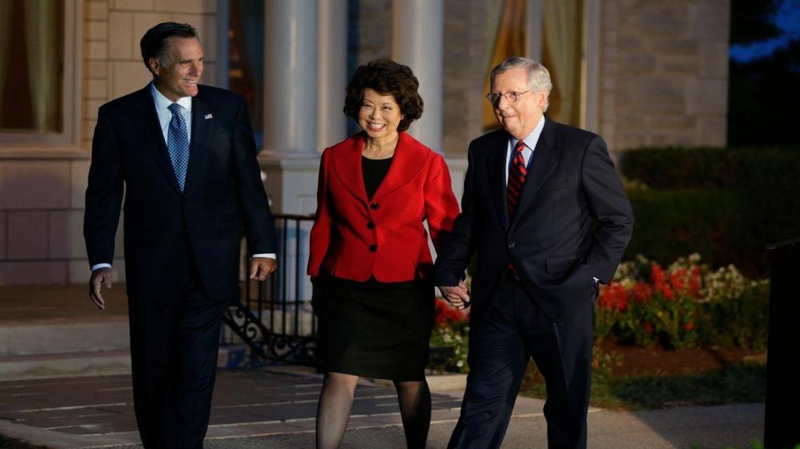 Kentucky Sen. Mitch McConnell , right, held a press conference with his wife, Elaine Chao, and Mitt Romney at Donamire Farm on Thursday October 2, 2014 in Lexington, Ky.
