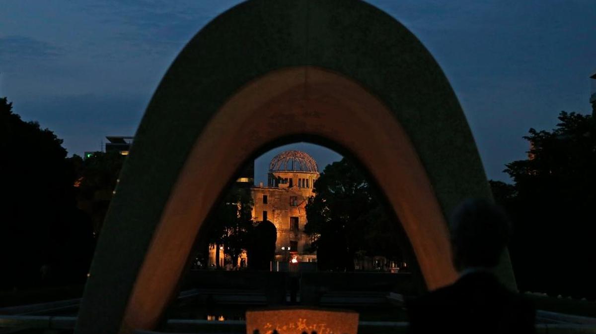 The Atomic Bomb Dome is seen at dusk through the cenotaph at the Hiroshima Peace Memorial Park in Hiroshima, Hiroshima Prefecture, southern Japan, Thursday, May 26, 2016. U.S. President Barack Obama is to visit Hiroshima on May 27 after the Group of Seven summit in central Japan, becoming the first serving American president to do so.