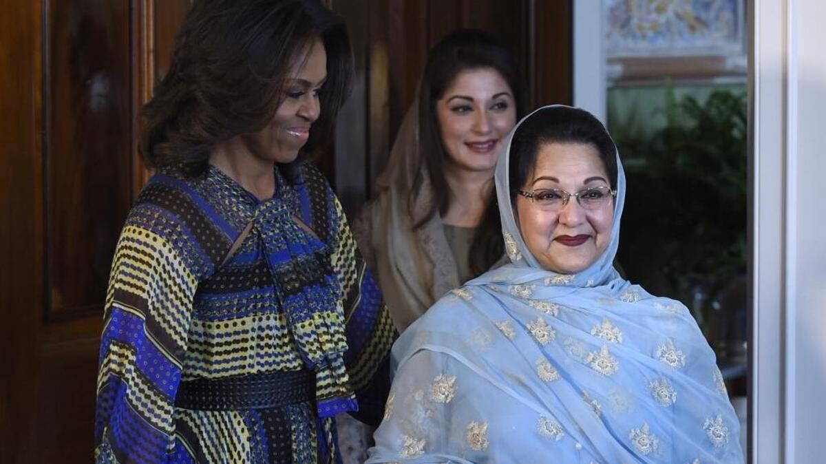 First lady Michelle Obama, Kalsoom Nawaz Sharif, wife of Pakistani Prime Minister Nawaz Sharif, and her daughter, Maryam Nawaz Sharif, arrive for an event Thursday in the Blue Room of the White House, where Obama announced a new partnership to further adolescent girls’ education in Pakistan.