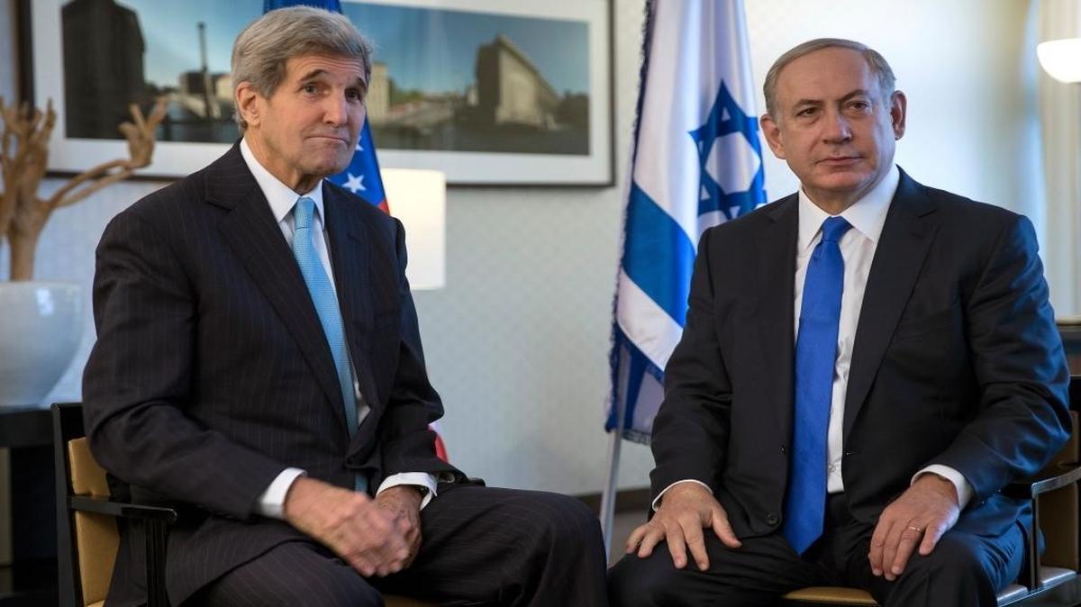 U.S. Secretary of State John Kerry, left, speaks with Israeli Prime Minister Benjamin Netanyahu during a meeting in Berlin on Thursday, Oct. 22, 2015. Kerry and Netanyahu called for an immediate end to incitement blamed for a recent deadly wave of Palestinian attacks against Israelis