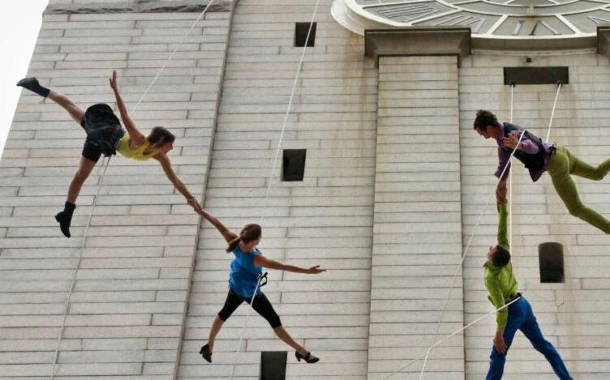 Aerial dancers with Project Bandaloop rehearse on the architecture of the Old Post Office Pavilion, home to the National Endowment for the Arts, in Washington, May 9, 2012.