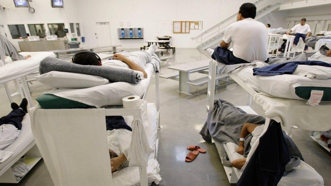 Detainees are shown resting on bunks inside the "B" cell and bunk unit of the Northwest Detention Center in Tacoma, Wash. The facility is operated by The GEO Group Inc. under contract from U.S. Immigration and Customs Enforcement.